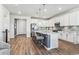 Modern kitchen featuring white cabinets, an island, and hardwood floors at 7870 Slate River St, Littleton, CO 80125