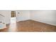 Spacious living room featuring stylish herringbone wood flooring at 9272 E Mansfield Ave, Denver, CO 80237
