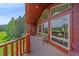 Inviting balcony with seating; expansive views at 27612 Shadow Mountain Dr, Conifer, CO 80433