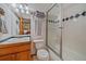 Well-maintained bathroom with a vanity, toilet, and shower perfect for easy upkeep and use at 27612 Shadow Mountain Dr, Conifer, CO 80433
