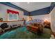Charming bedroom with a queen-size bed, exercise machine, and decor for a comfortable and active lifestyle at 27612 Shadow Mountain Dr, Conifer, CO 80433