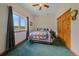 Bright bedroom with a large window, a cozy bed, and ample natural light perfect for relaxation and comfort at 27612 Shadow Mountain Dr, Conifer, CO 80433