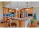 Kitchen with breakfast bar and granite countertops at 27612 Shadow Mountain Dr, Conifer, CO 80433