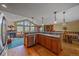 Modern kitchen seamlessly flows into a living area; beautiful hardwood floors at 27612 Shadow Mountain Dr, Conifer, CO 80433