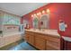 Main bathroom features double sinks, tiled countertops, and a combination shower and bathtub at 27612 Shadow Mountain Dr, Conifer, CO 80433