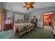 Comfortable main bedroom features a ceiling fan, a window, and access to the main bathroom at 27612 Shadow Mountain Dr, Conifer, CO 80433