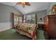 Comfortable main bedroom features a ceiling fan, a window, and access to the outdoor deck at 27612 Shadow Mountain Dr, Conifer, CO 80433