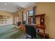 Bright home office featuring a desk, chair, and natural light perfect for productivity and comfort at 27612 Shadow Mountain Dr, Conifer, CO 80433