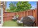 Outdoor patio area with seating, barbecue grill, and privacy fencing at 12142 Bannock Cir # B, Denver, CO 80234