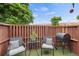 Outdoor patio area with seating, barbecue grill, and privacy fencing at 12142 Bannock Cir # B, Denver, CO 80234