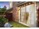 Charming back patio with artificial turf, sliding door, and decorative string lights at 12142 Bannock Cir # B, Denver, CO 80234