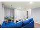 Bright basement with recessed lights, TV and comfortable sectional sofa at 12142 Bannock Cir # B, Denver, CO 80234