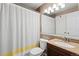 Neutral toned bathroom with a shower-tub combo and stylish vanity at 12142 Bannock Cir # B, Denver, CO 80234