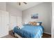 Relaxing bedroom showcases ample closet space, ceiling fan, and natural light from the window at 12142 Bannock Cir # B, Denver, CO 80234