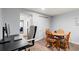 Basement dining area with seating for four and a desk space at 12142 Bannock Cir # B, Denver, CO 80234