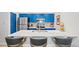 Eat-in kitchen featuring a large center island, seating, and stainless steel appliances at 12142 Bannock Cir # B, Denver, CO 80234