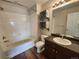 Bathroom featuring vanity, bathtub, and toilet with white tiles offers comfort and functionality at 12753 Ivanhoe St, Thornton, CO 80602