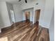 Comfortable bedroom with wood floors, doors to bathroom and closet, ceiling fan, bright and modern look at 12753 Ivanhoe St, Thornton, CO 80602