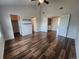 Spacious bedroom with multiple doors, wood floors and high ceiling with fan offer modern comfort at 12753 Ivanhoe St, Thornton, CO 80602