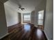 Spacious bedroom with natural light, wood flooring, and a door to the closet offers comfort and functionality at 12753 Ivanhoe St, Thornton, CO 80602