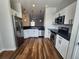 Bright kitchen with stainless steel refrigerator, sleek countertops, and updated appliances at 12753 Ivanhoe St, Thornton, CO 80602