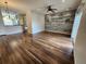 Open-concept living space with modern accents, wood floors, and lots of natural light at 12753 Ivanhoe St, Thornton, CO 80602