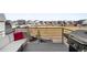 Outdoor deck area with seating and grill overlooking a neighborhood playground at 21925 E 44Th Pl, Aurora, CO 80019