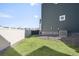 Backyard with green lawn, rock landscaping, and privacy fencing at 21925 E 44Th Pl, Aurora, CO 80019
