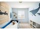 Adorable bedroom with blue walls, fun whale decor, and carpeted flooring at 21925 E 44Th Pl, Aurora, CO 80019