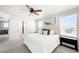 Main bedroom with ceiling fan, carpet flooring, and plenty of natural lighting at 21925 E 44Th Pl, Aurora, CO 80019