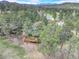 Stunning aerial view of the home surrounded by lush greenery and mature trees at 2434 Hearth Dr # C1, Evergreen, CO 80439
