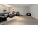 Finished basement with carpet, sectional sofa, and open space at 2434 Hearth Dr # C1, Evergreen, CO 80439