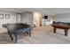 Finished basement features a ping pong table, pool table, and stairs at 2434 Hearth Dr # C1, Evergreen, CO 80439