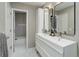 Modern bathroom features double vanity, large mirrors, and a view of the tub/shower at 2434 Hearth Dr # C1, Evergreen, CO 80439
