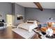 Modern bedroom featuring a neutral color palette, stylish decor, and a comfortable bed at 2434 Hearth Dr # C1, Evergreen, CO 80439