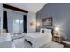 Stylish bedroom featuring a plush rug, comfortable bed, and a window seat with a view at 2434 Hearth Dr # C1, Evergreen, CO 80439