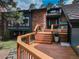 Inviting front entrance featuring a wood porch with wood steps, and beautiful stone accents at 2434 Hearth Dr # C1, Evergreen, CO 80439