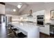Modern kitchen with stainless steel appliances, a large island, and ample counter space for meal preparation at 2434 Hearth Dr # C1, Evergreen, CO 80439
