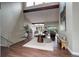 Spacious living room with hardwood floors, modern decor, and a vaulted ceiling at 2434 Hearth Dr # C1, Evergreen, CO 80439