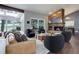 Inviting living room with a stone fireplace, modern furniture, and access to an outdoor deck at 2434 Hearth Dr # C1, Evergreen, CO 80439