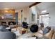 Stylish living room featuring a stone fireplace, hardwood floors, and comfortable seating at 2434 Hearth Dr # C1, Evergreen, CO 80439