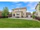 Spacious backyard with a patio, grill, outdoor seating, lush lawn, and a storage shed at 5161 Chicory Cir, Brighton, CO 80601