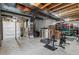 Unfinished basement space features exposed beams, utilities, and ample room for storage or customization at 5161 Chicory Cir, Brighton, CO 80601
