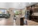 Bright kitchen boasts a granite island, stainless steel appliances, and an open floor plan at 5161 Chicory Cir, Brighton, CO 80601