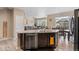 Stylish kitchen with a granite island featuring a stainless steel dishwasher and a modern faucet at 5161 Chicory Cir, Brighton, CO 80601
