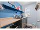 Functional laundry room with counterspace and front-load washer and dryer at 5161 Chicory Cir, Brighton, CO 80601
