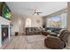 Spacious living room featuring a fireplace, modern decor, and comfortable seating at 5161 Chicory Cir, Brighton, CO 80601