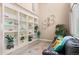 Elegant living room with high ceilings, built-in shelves, and comfortable seating at 5161 Chicory Cir, Brighton, CO 80601