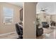Open-concept living room with a desk, providing space for a home office setup and relaxation at 5161 Chicory Cir, Brighton, CO 80601