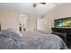 Spacious main bedroom with a vaulted ceiling, walk-in closet, and an en-suite bathroom entrance at 5161 Chicory Cir, Brighton, CO 80601